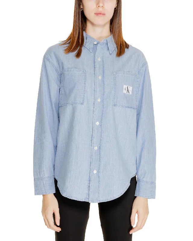 Calvin Klein Jeans Women's Classic Relaxed Fit Jean Shirt - Light Blue-- Modern Contemporary Chic Calvin Klein Jeans Women's Classic Relaxed Fit Jean Shirt - Light Blue-- Modern Contemporary Chic